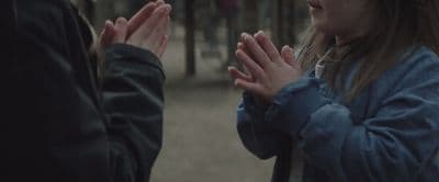 a couple of people standing next to each other