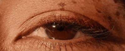 a close up of a person's brown eye