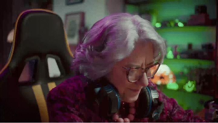 a woman with purple hair wearing headphones