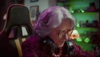 a woman with purple hair wearing headphones