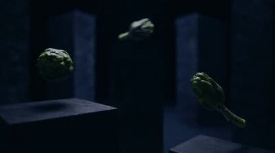 a bunch of broccoli floating in the air