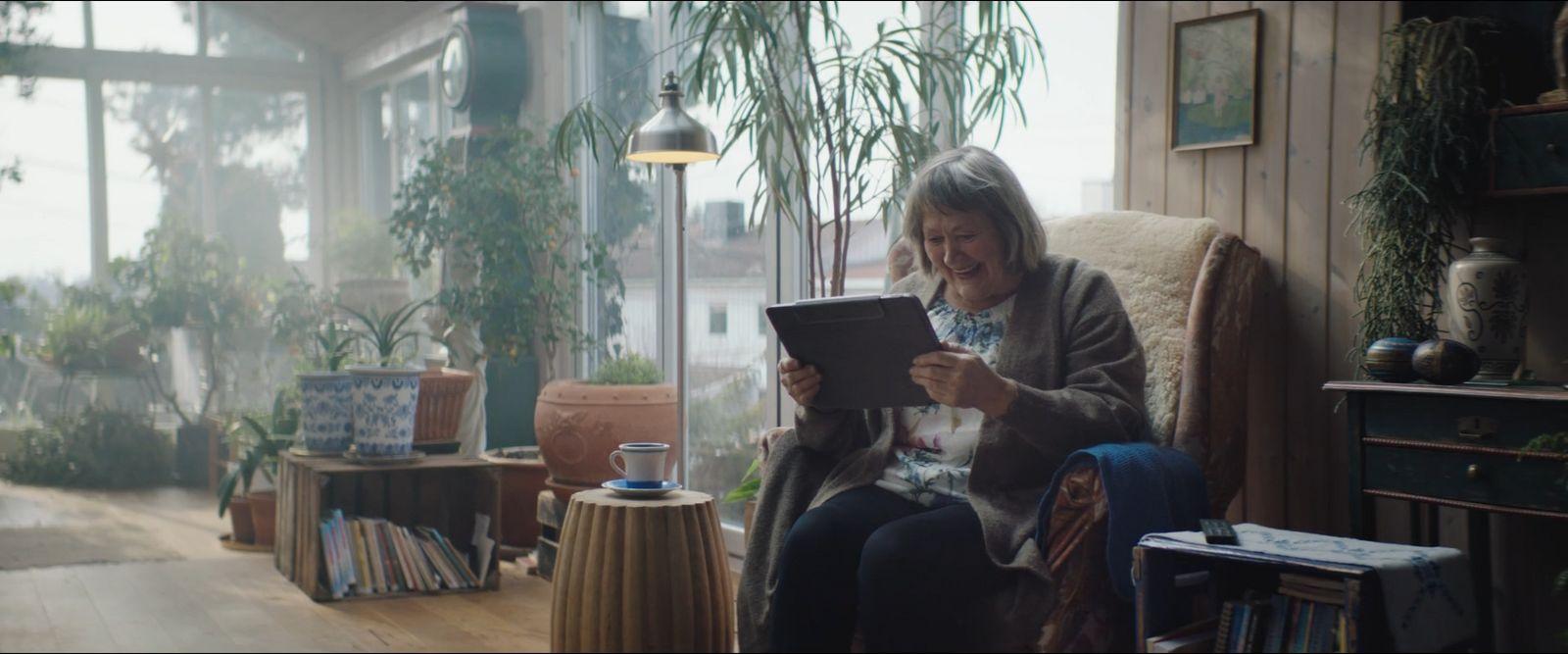 a woman sitting in a chair reading a book