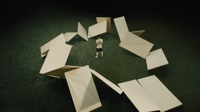 a person standing in front of a pile of paper