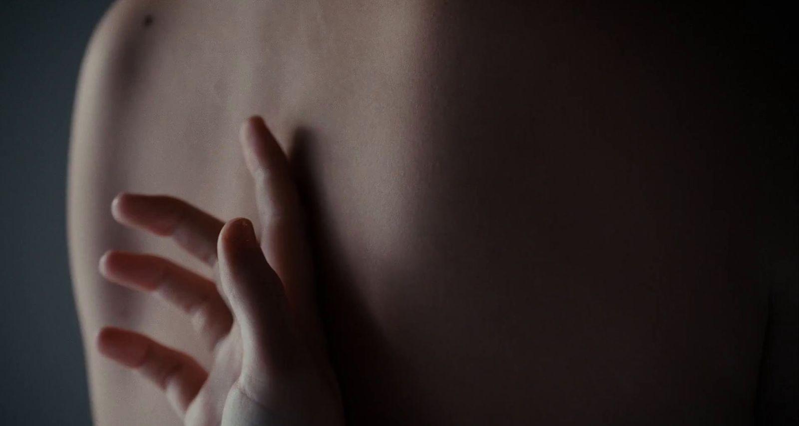 a woman's arm with a ring on it