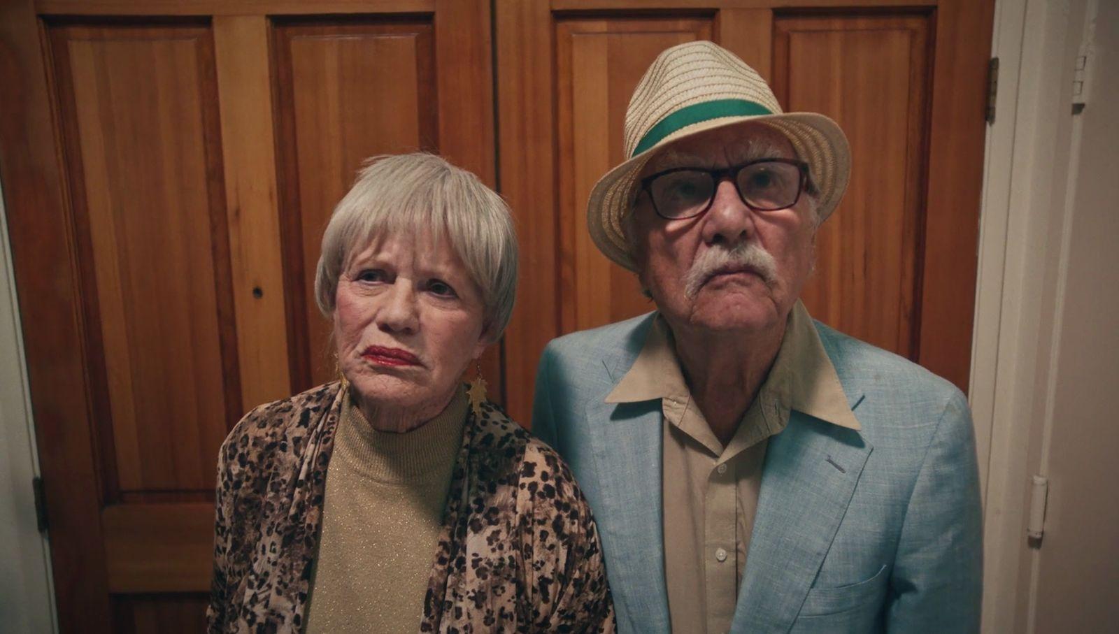 a man and a woman standing next to each other