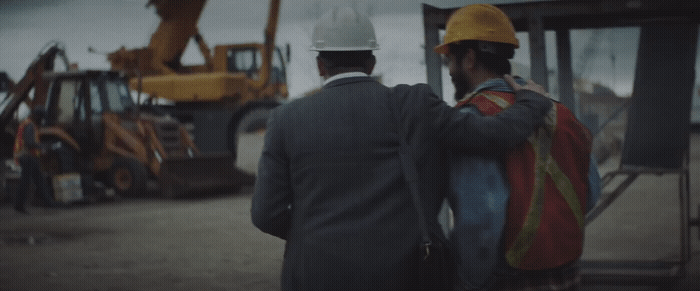 a couple of men standing next to each other