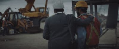 a couple of men standing next to each other