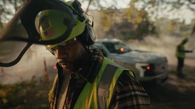 a man wearing a hard hat and a safety vest
