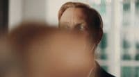 a man looking at himself in the mirror