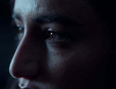 a close up of a person's face in the dark
