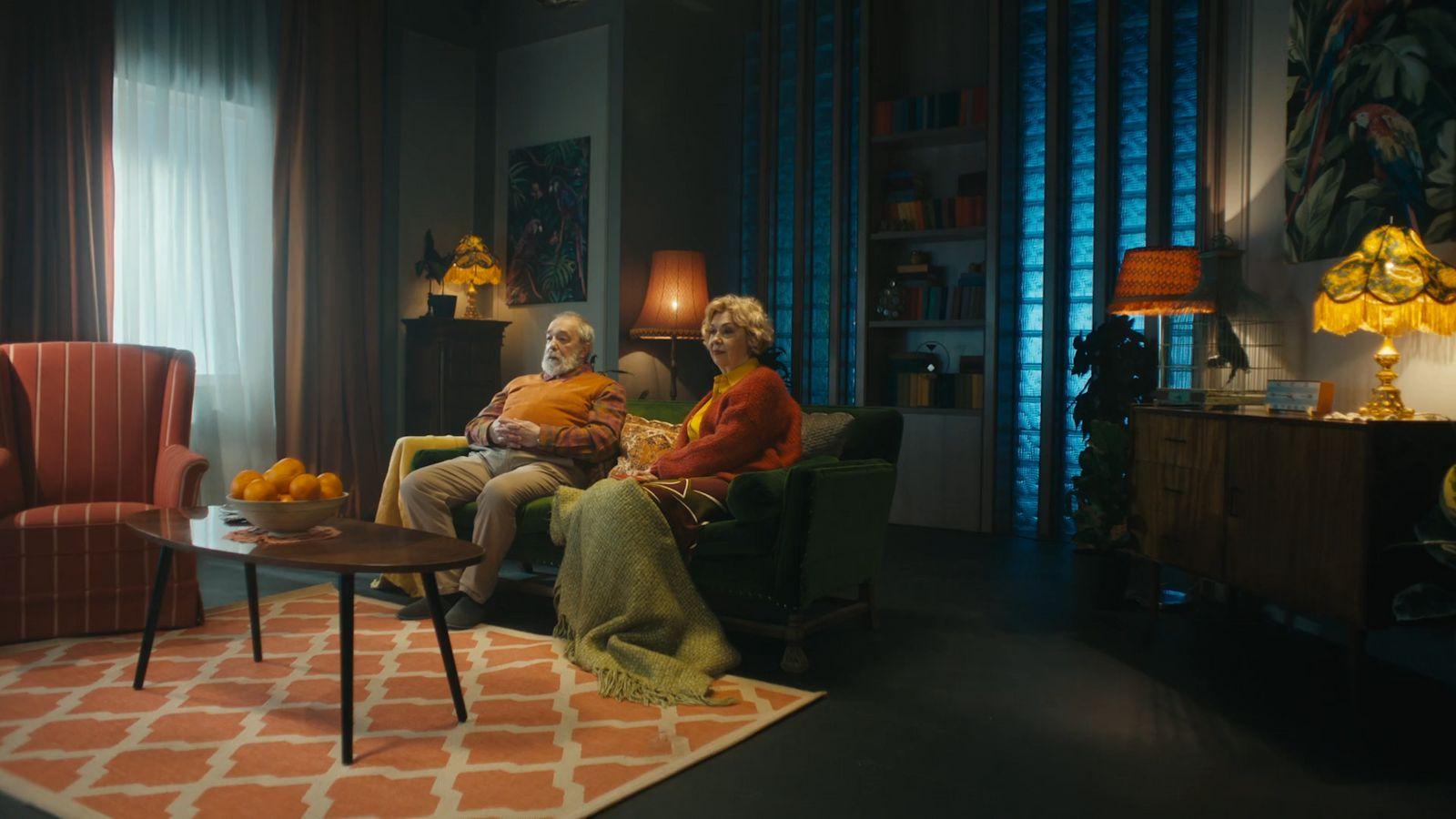 a couple of people that are sitting in a chair