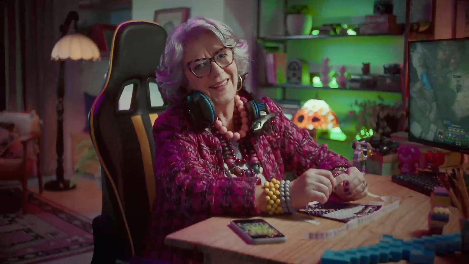 a woman sitting at a desk with headphones on