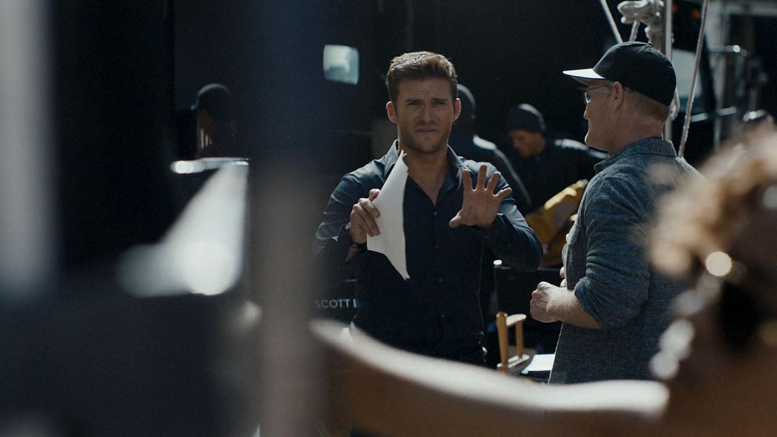 a couple of men standing next to each other