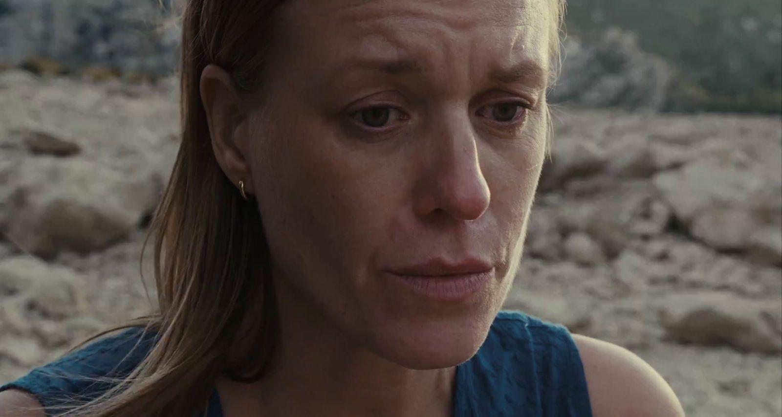 a close up of a woman with a concerned look on her face