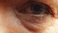 a close up of a person's blue eye