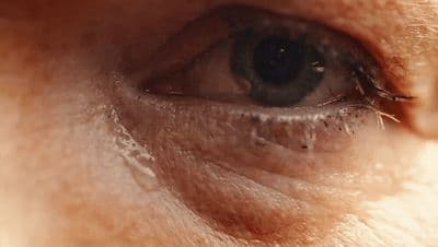 a close up of a person's blue eye