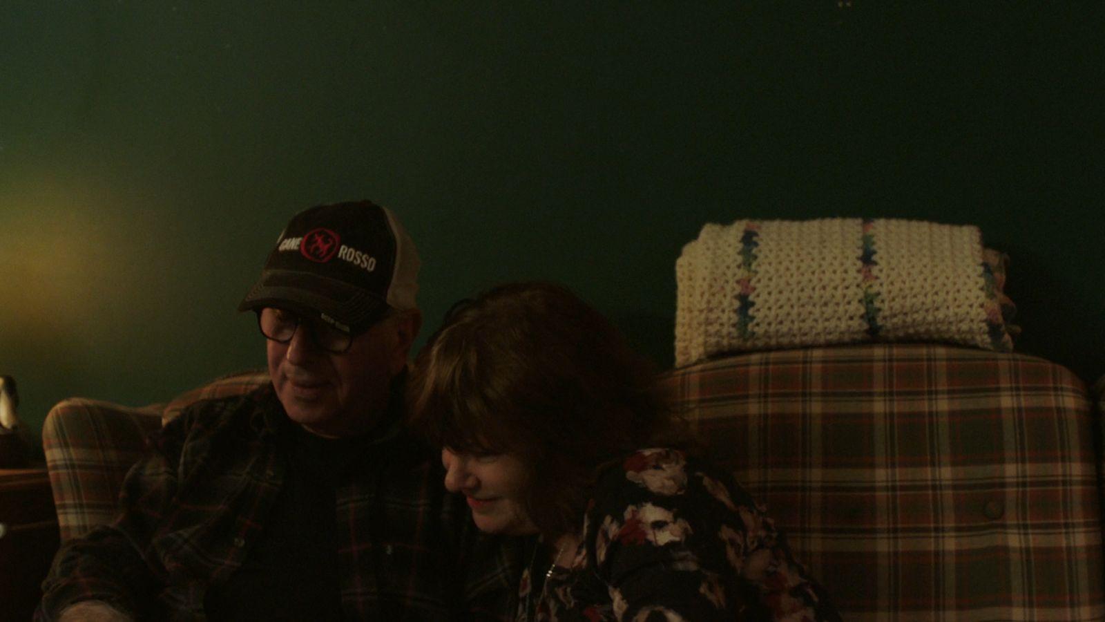 a man and a woman sitting on a couch