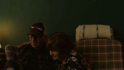 a man and a woman sitting on a couch