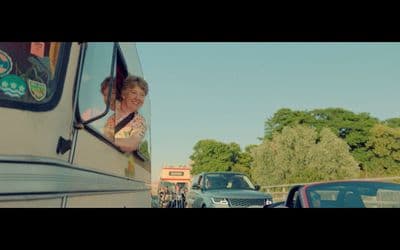 a woman is looking out the window of a bus