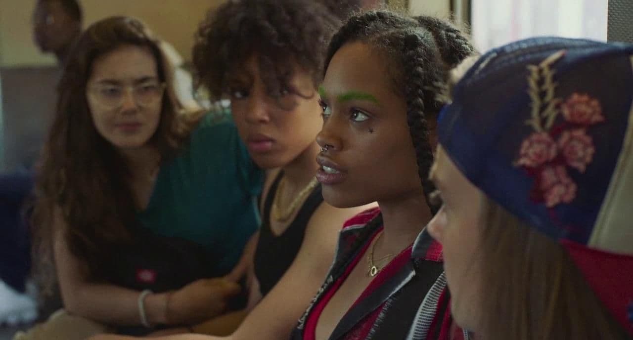 a group of women sitting next to each other