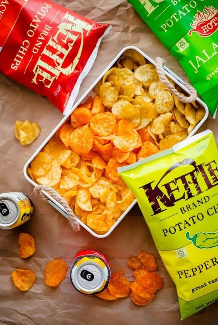 a couple of bags of potato chips next to a bag of chips