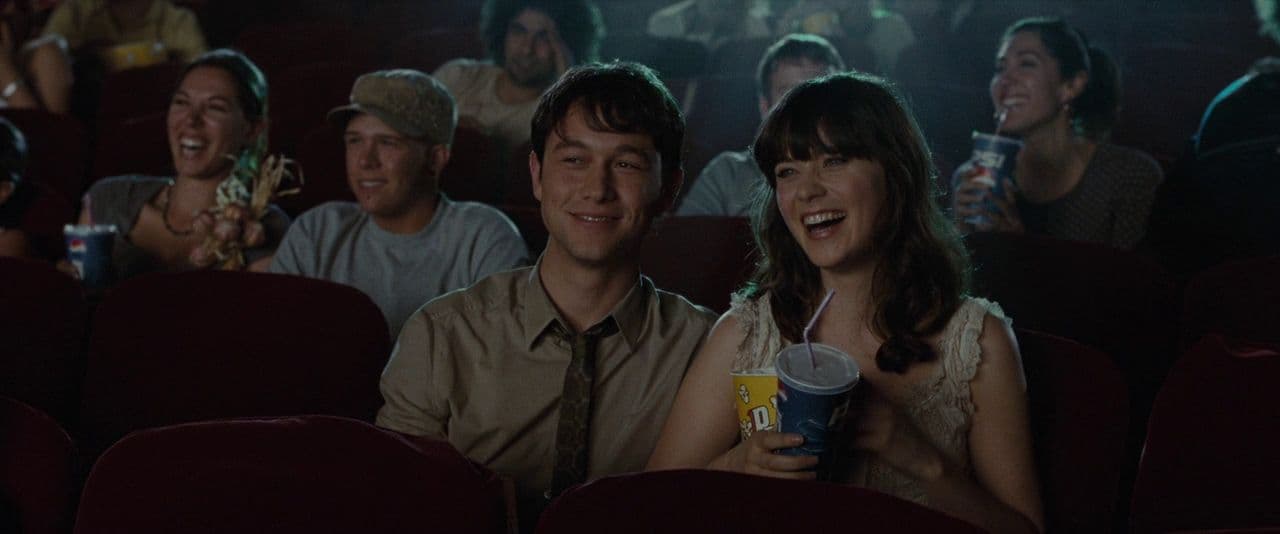 a group of people sitting in a movie theater