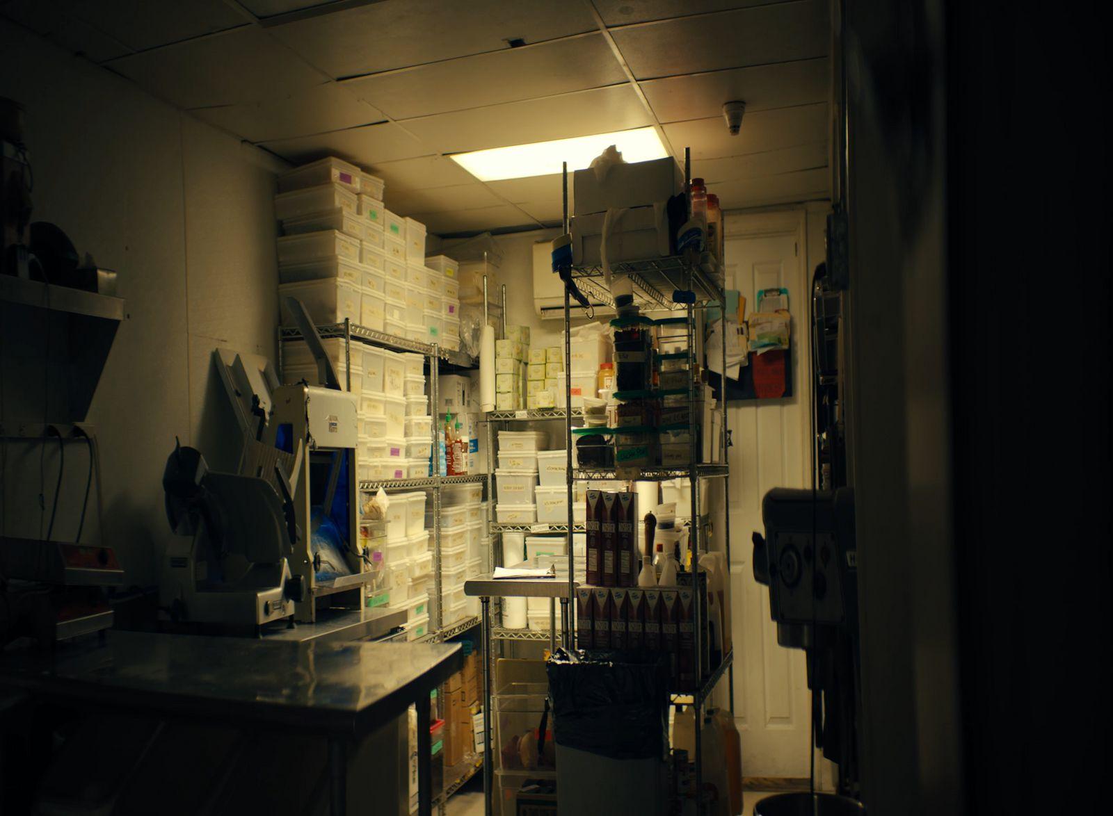 a kitchen with a lot of boxes on the wall