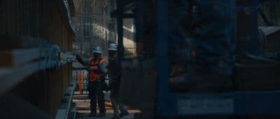 a couple of men standing next to each other