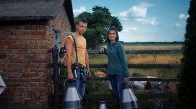 a man and a woman standing next to each other