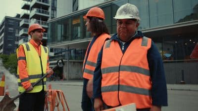 a group of construction workers standing next to each other