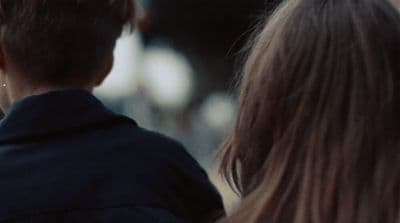 a man and a woman standing next to each other