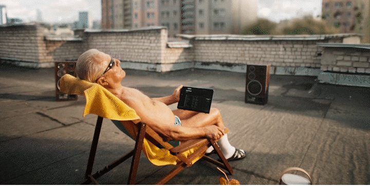 a man sitting in a chair on top of a roof