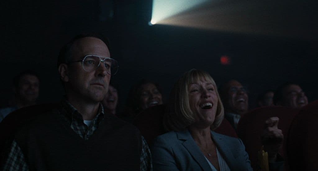 a group of people sitting next to each other