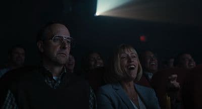 a group of people sitting next to each other