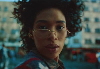 a close up of a person wearing glasses