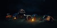 a group of people camping in the dark