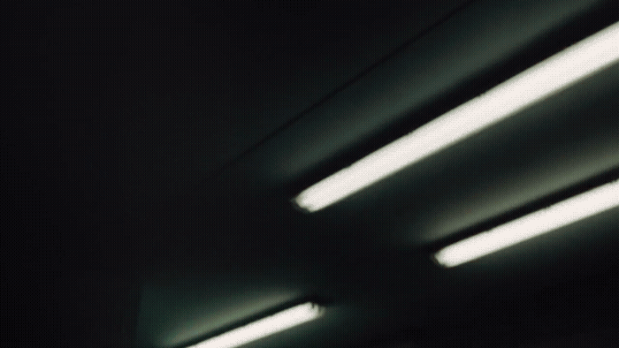 a black and white photo of lights in a dark room