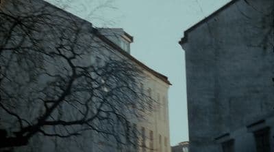 a couple of tall buildings sitting next to each other