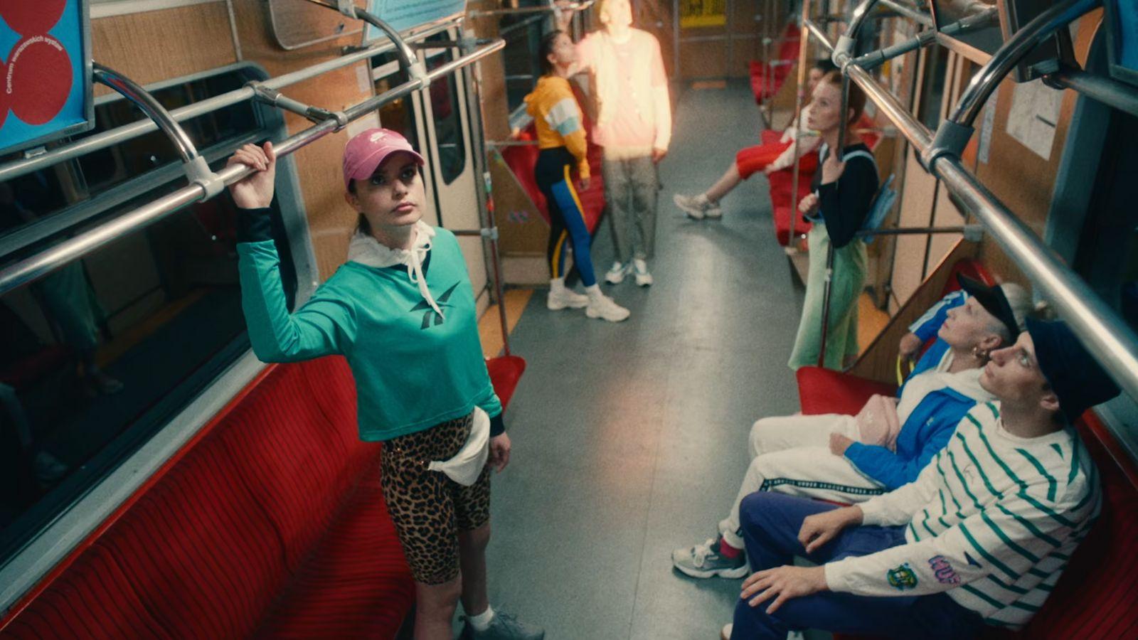 a group of people riding on a train next to each other