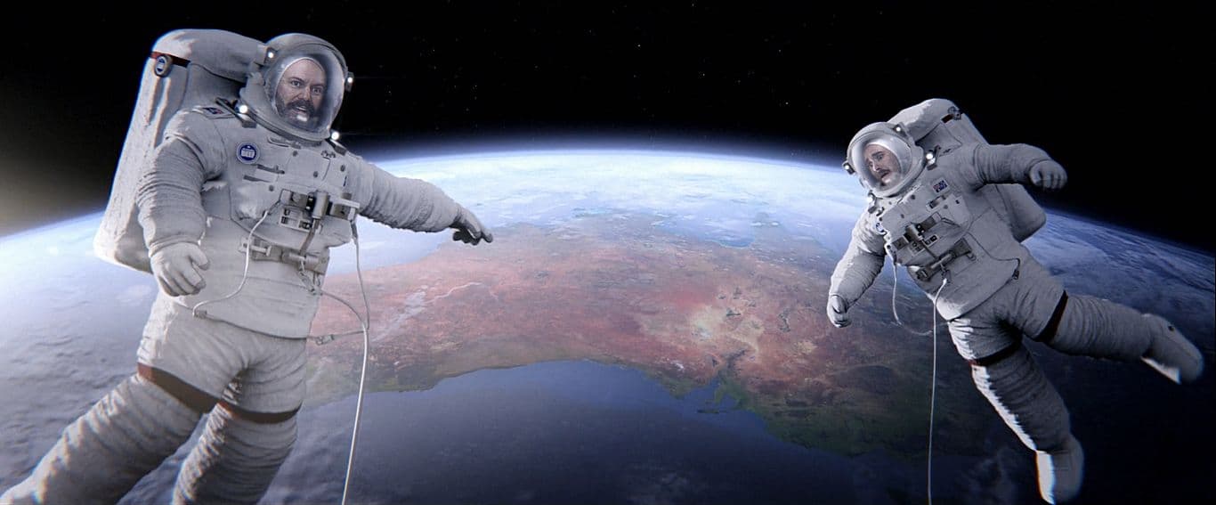 a couple of astronauts floating in space next to each other