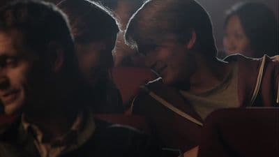a group of people sitting next to each other