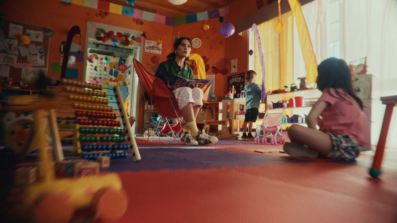 a group of children sitting on the floor in a room