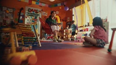 a group of children sitting on the floor in a room
