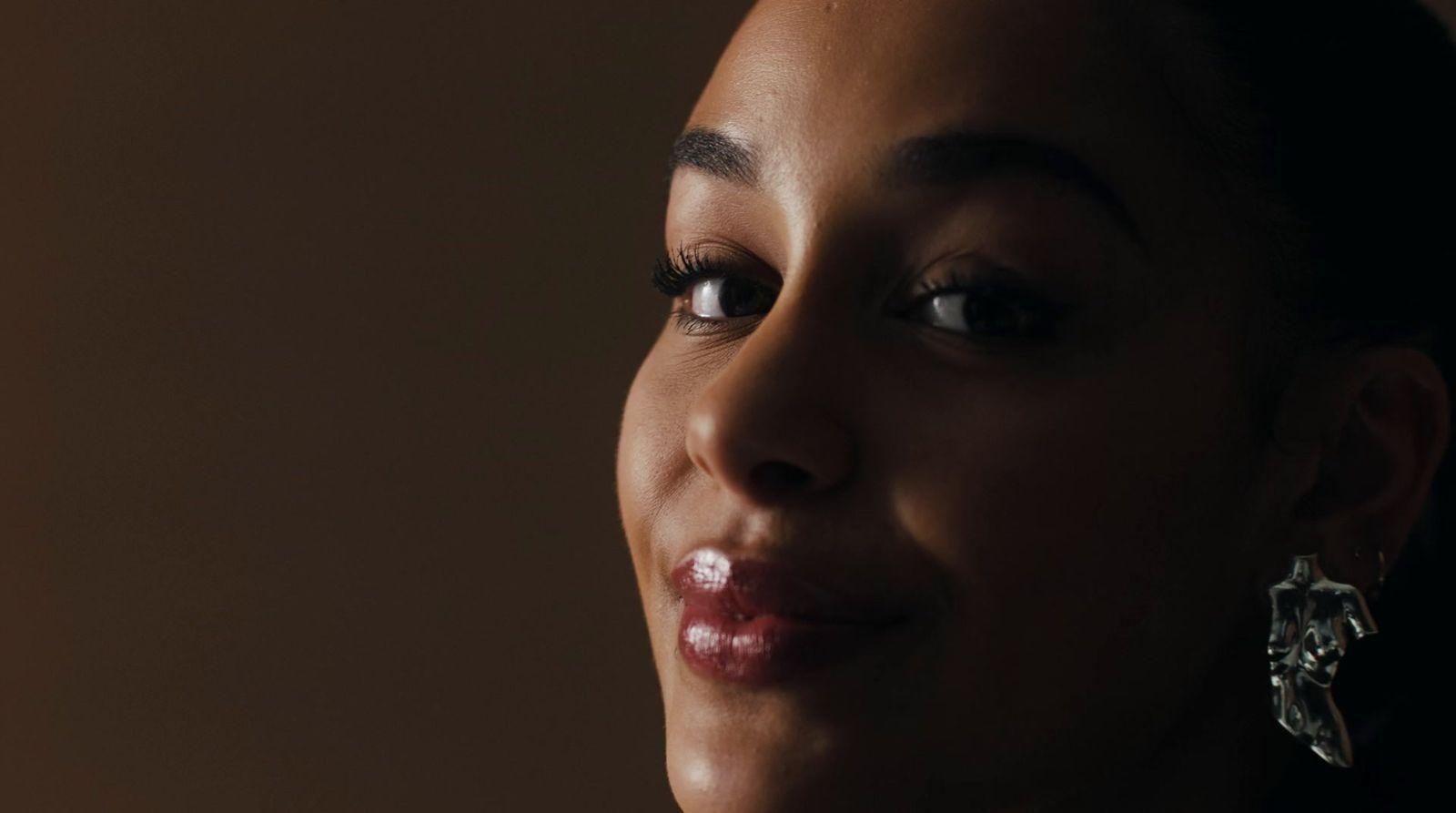 a close up of a person wearing earrings