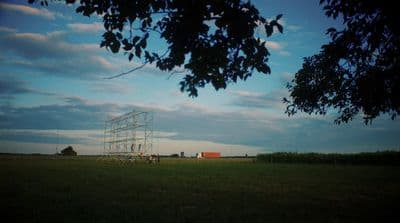 a power line in the middle of a field