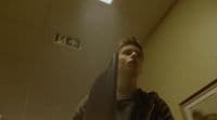 a man standing in front of a mirror in a bathroom