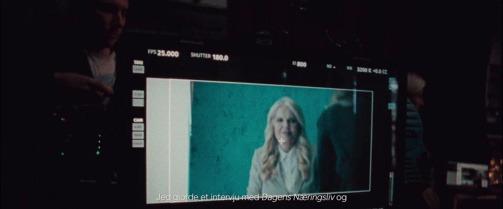 a television screen with a picture of a woman on it