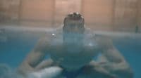a man sitting in a pool of water