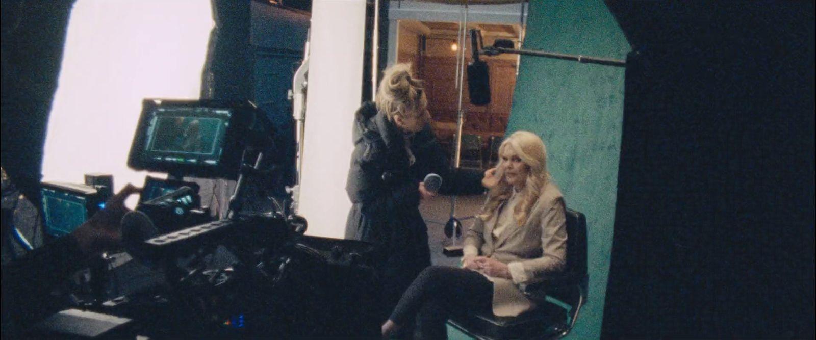 a couple of women sitting next to each other