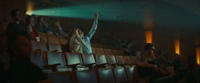 a group of people sitting in a theater